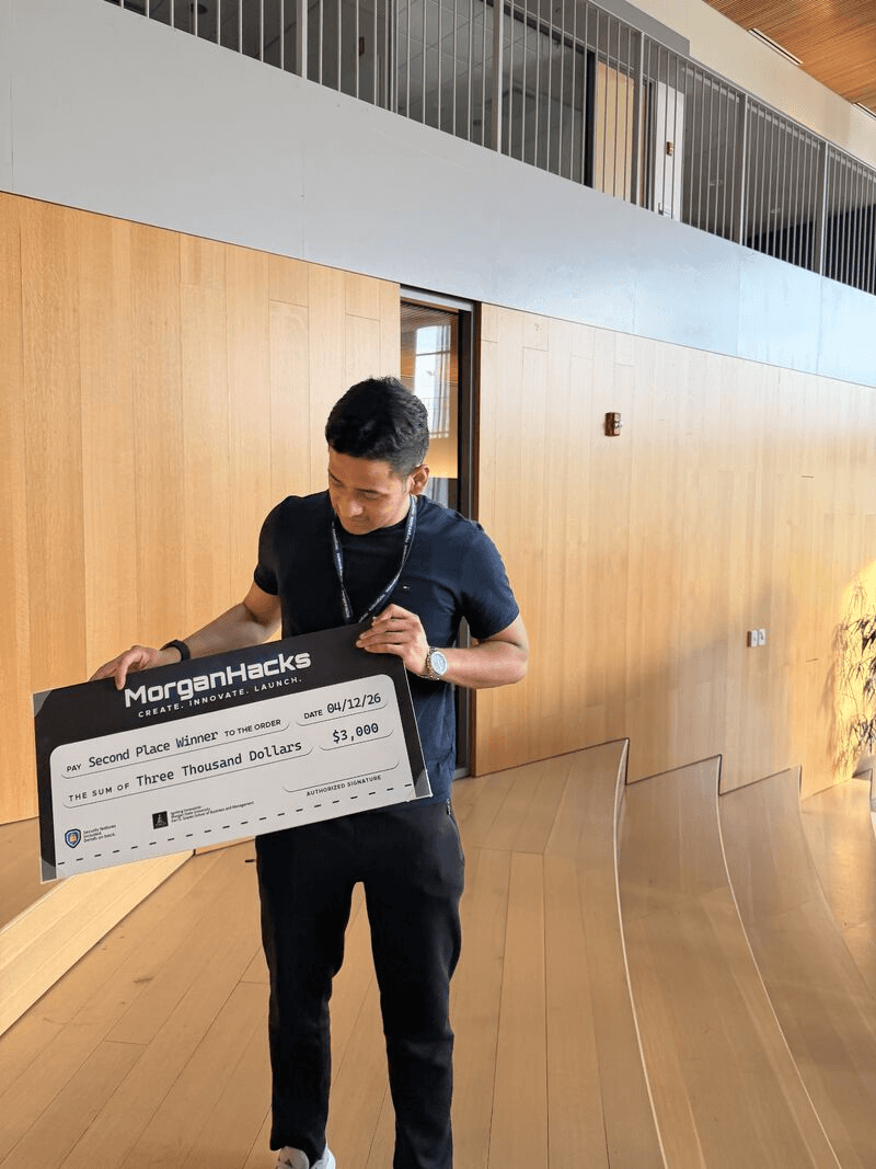 Mingma holding the $3,000 Second Place check from MorganHacks 2026